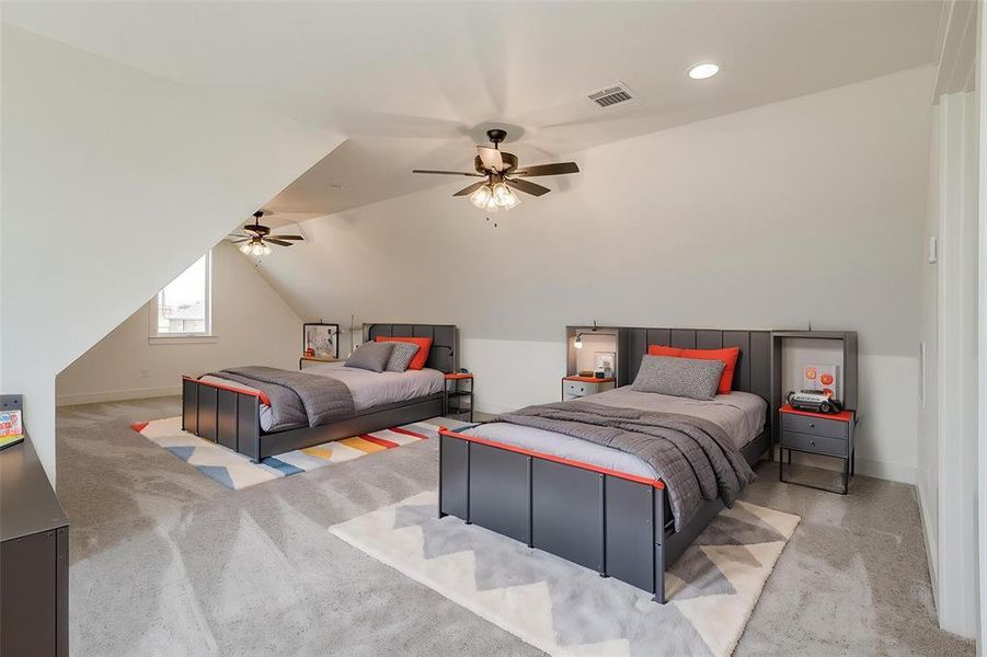 Bedroom with carpet, ceiling fan, baseboards, vaulted ceiling, and recessed lighting Bedroom with carpet, ceiling fan, baseboards, vaulted ceiling, and recessed lighting