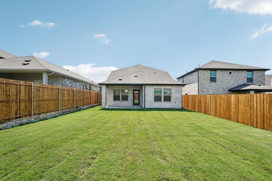 Exterior details and patio area of a home in Simpson Crossing - Spring Series, McKinney (Image 22). Exterior details and patio area of a home in Simpson Crossing - Spring Series, McKinney (Image 22).