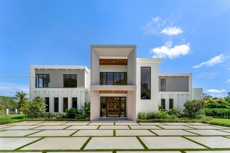 Front exterior of a new home in , Pinecrest, FL, highlighting curb appeal (Image 25).