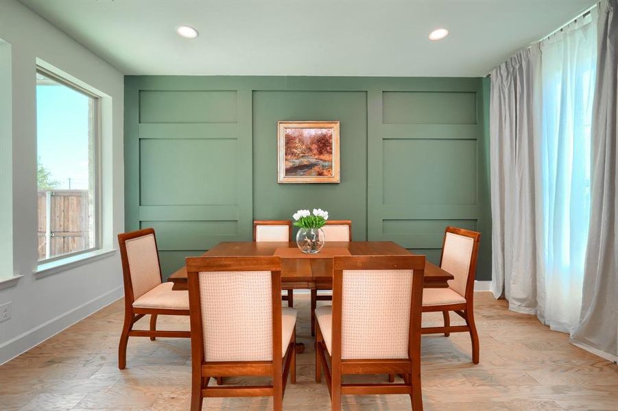 Dining area with a healthy amount of sunlight and light wood-type flooring