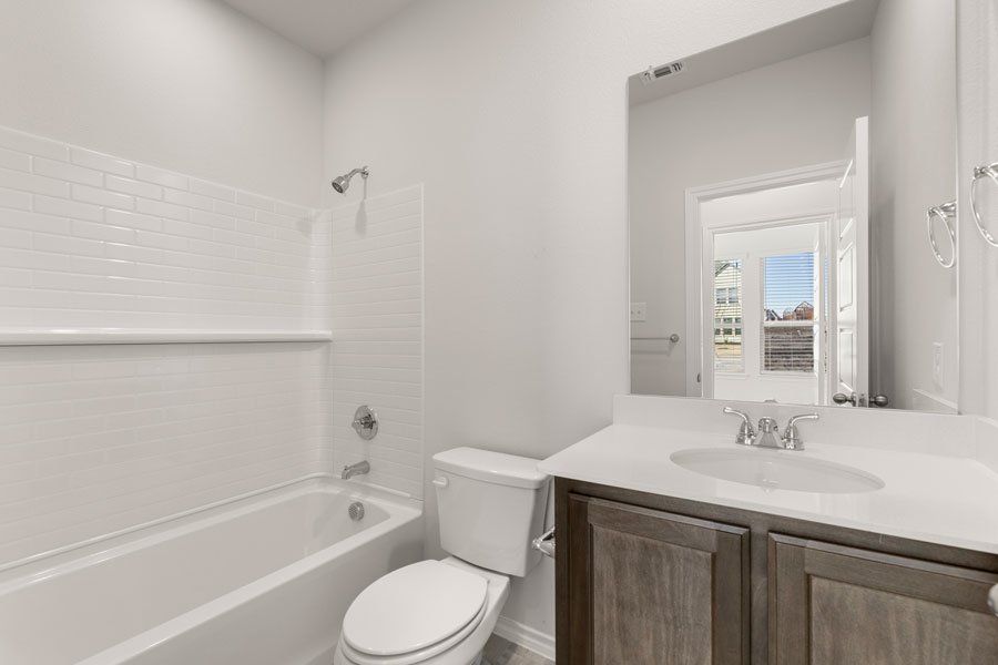 Representative exterior photo of a completed home built from the Conroe by Impression Homes in Creekshaw, Royse City, TX (Image 18). Representative exterior photo of a completed home built from the Conroe by Impression Homes in Creekshaw, Royse City, TX (Image 18).