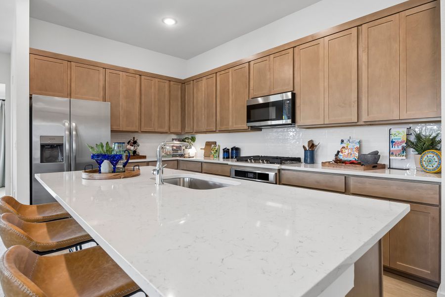 Kitchen in the Pecos home plan by Trophy Signature Homes – REPRESENTATIVE PHOTO