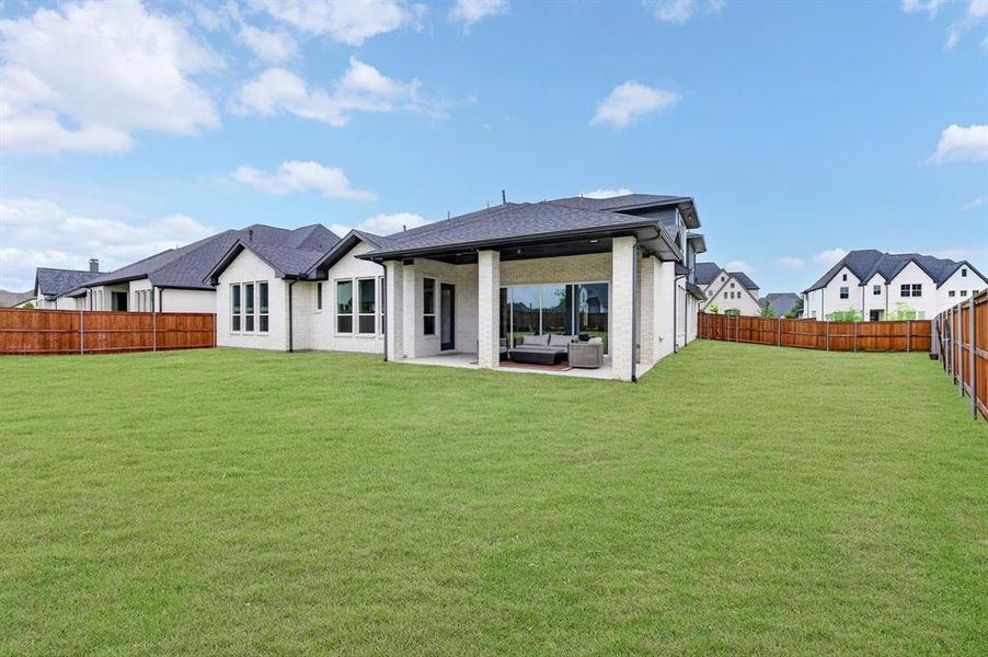 Exterior details and patio area of a home in Light Farms Graham/Reagan, Celina (Image 4).