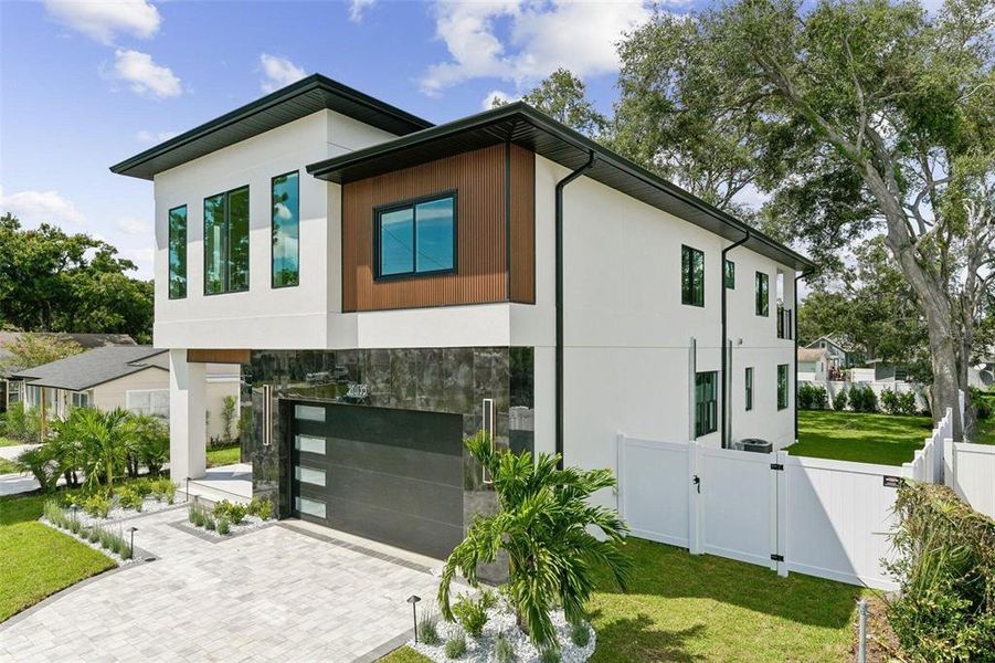 Front exterior of a new home in Wyoming Estates, Tampa, FL, highlighting curb appeal (Image 2). Front exterior of a new home in Wyoming Estates, Tampa, FL, highlighting curb appeal (Image 2).