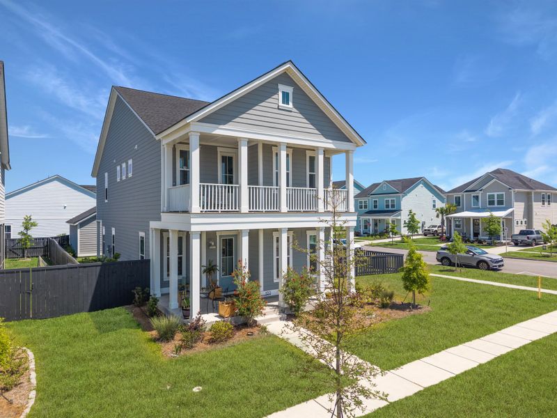 Front exterior of a new home in Carnes Crossroads, Summerville, SC, highlighting curb appeal (Image 2). Front exterior of a new home in Carnes Crossroads, Summerville, SC, highlighting curb appeal (Image 2).