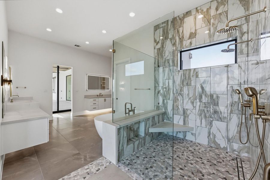 Two vanities, oversized shower with seat and of course a window for natural light!