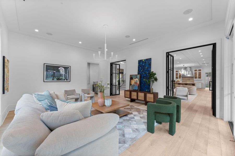 The glass double doors flow into the great room and chef’s kitchen, perfectly designed for gatherings and entertaining The glass double doors flow into the great room and chef’s kitchen, perfectly designed for gatherings and entertaining