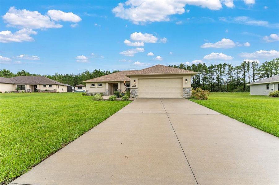 Front exterior of a new home in , Inverness, FL, highlighting curb appeal (Image 24).