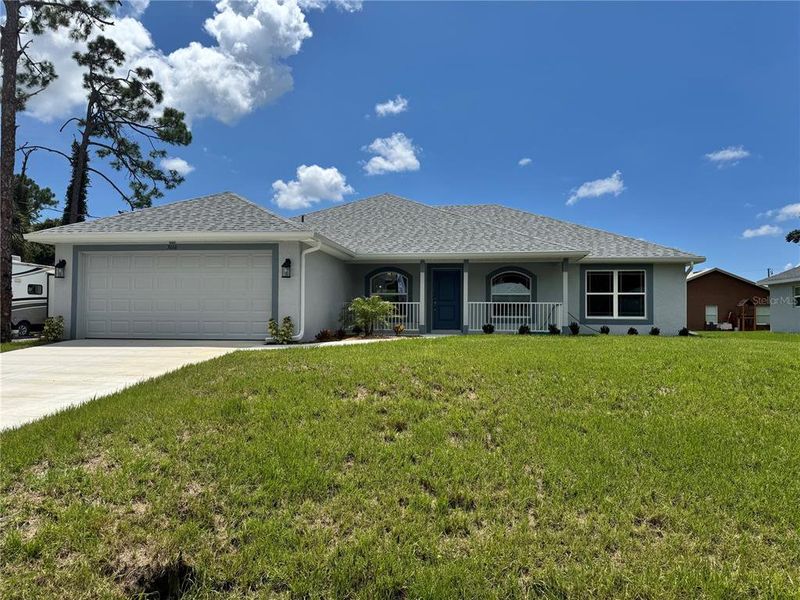 Front exterior of a new home in North Port, North Port, FL, highlighting curb appeal (Image 2). Front exterior of a new home in North Port, North Port, FL, highlighting curb appeal (Image 2).