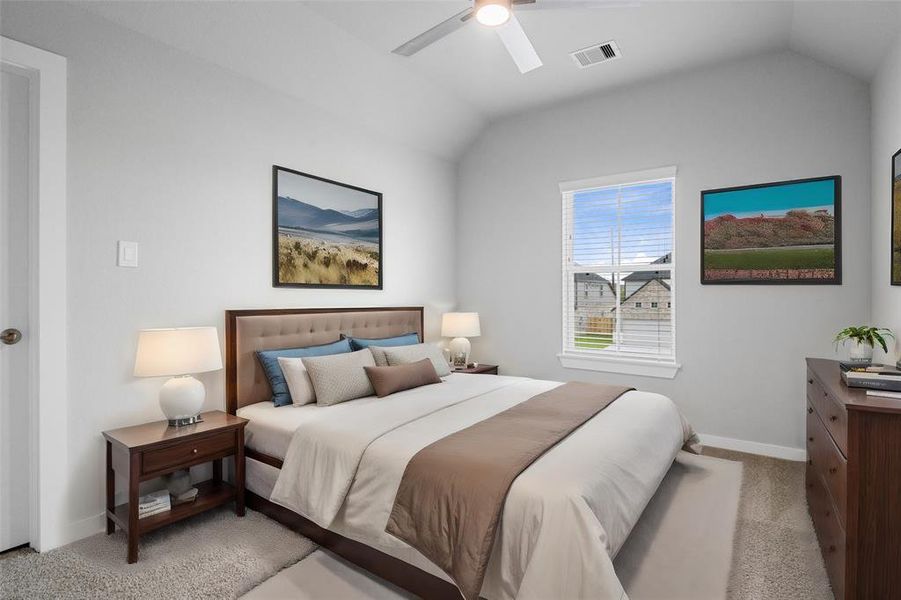 Secondary bedroom features plush carpet, custom paint, ceiling fan, and large window with privacy blinds.