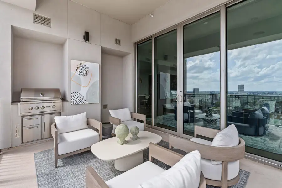 A true extension of the interior’s grand scale. This balcony isn't just an accent; it’s a destination. With a spacious footprint large enough for a summer kitchen and comfortable seating, it’s the ultimate venue for sunset cocktails and moonlit dinners. Above the noise and among the stars, it’s a sanctuary where the city lights are the only guest list you need. A true extension of the interior’s grand scale. This balcony isn't just an accent; it’s a destination. With a spacious footprint large enough for a summer kitchen and comfortable seating, it’s the ultimate venue for sunset cocktails and moonlit dinners. Above the noise and among the stars, it’s a sanctuary where the city lights are the only guest list you need.