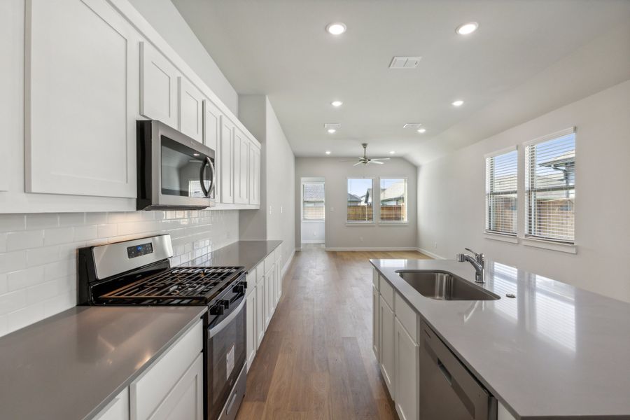 Kitchen in the Cedar home plan by Trophy Signature Homes – REPRESENTATIVE PHOTO