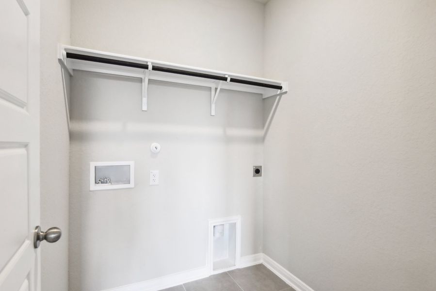 Laundry room in the Medina floorplan at a Meritage Homes community.