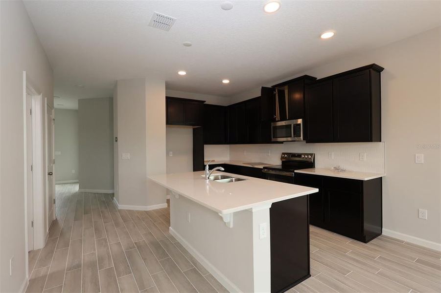 Furnished interior view inside a new home in Tribute at Ovation, Winter Garden (Image 10).