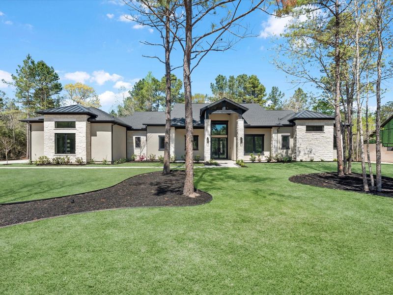Front exterior of a new home in , Montgomery, TX, highlighting curb appeal (Image 2).