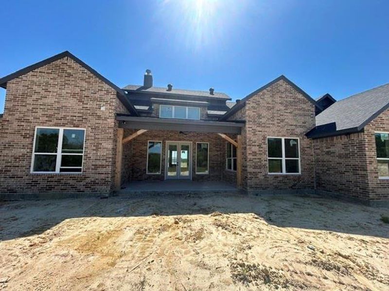 Brick exterior with multi-toned masonry and white-framed windows