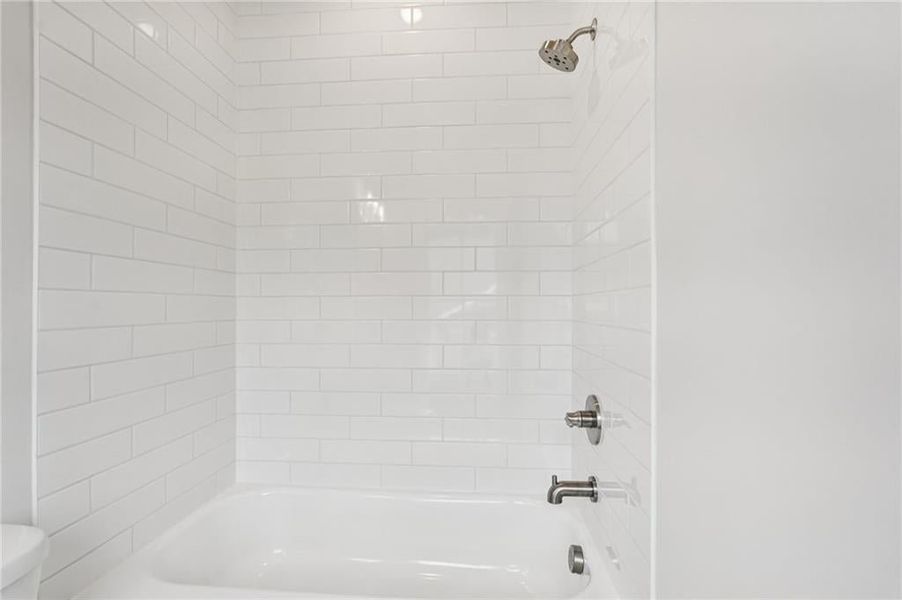 Full bath with bathtub / shower combination and toilet