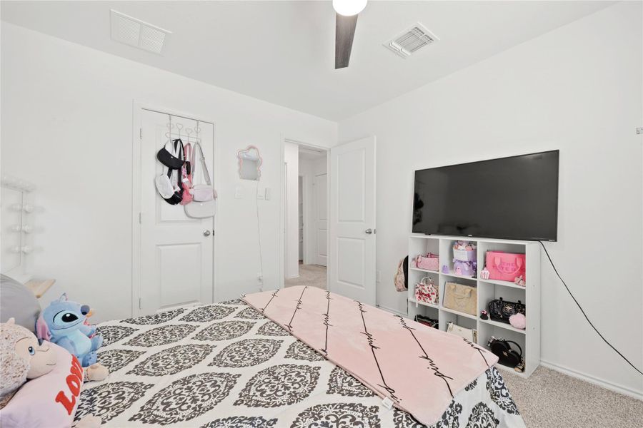 Versatile and cozy, this secondary bedroom offers a perfect layout for a dedicated guest suite or home office, with neutral tones that complement any decor style.