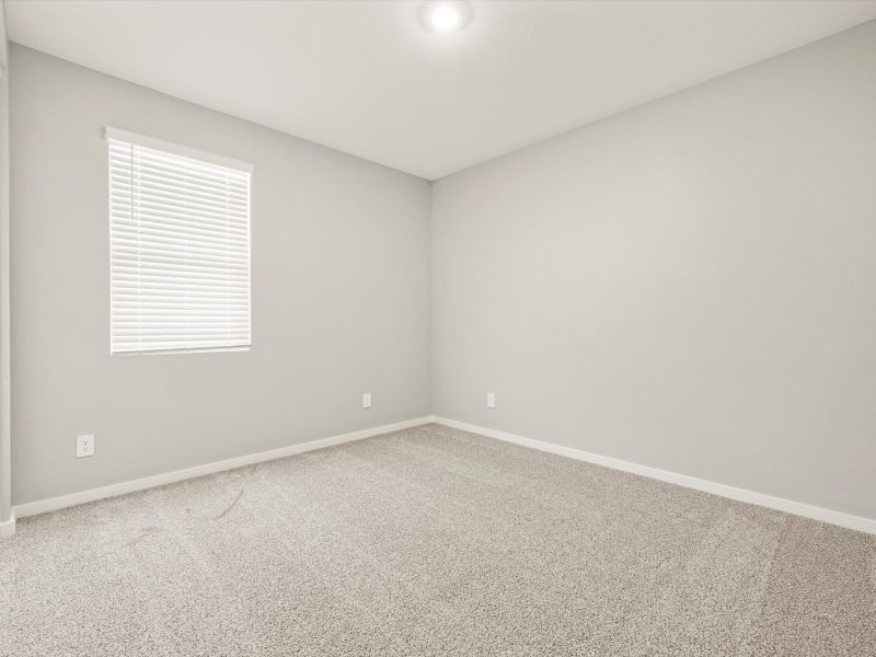 Spacious, unfurnished interior of a new home in Blossom Rock Reserve Series, Apache Junction (Image 15).