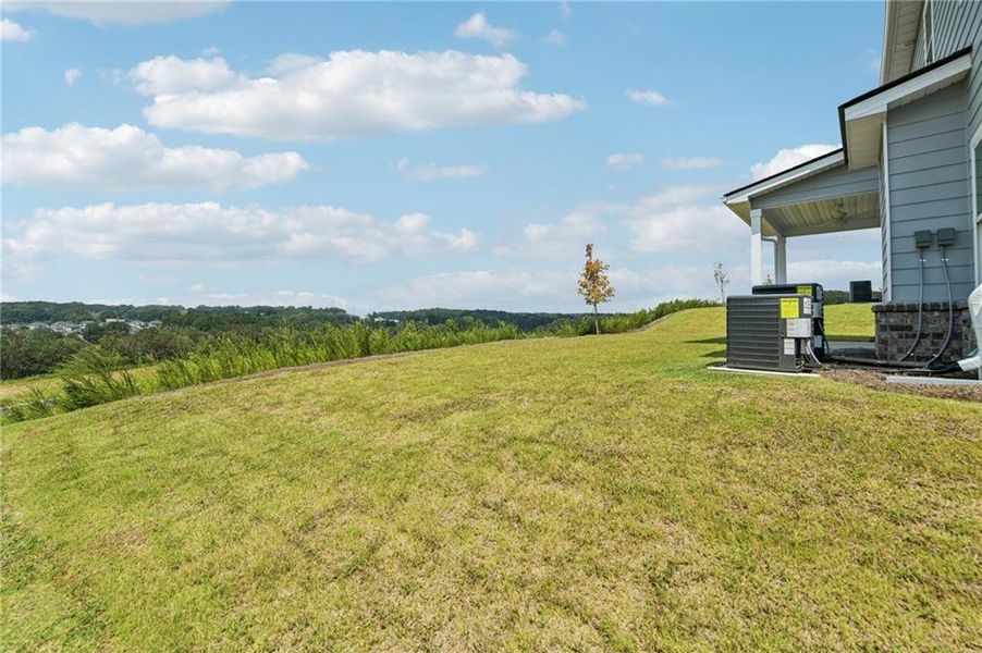 Exterior details and patio area of a home in The Hills at Cedar Creek, Winder (Image 25).