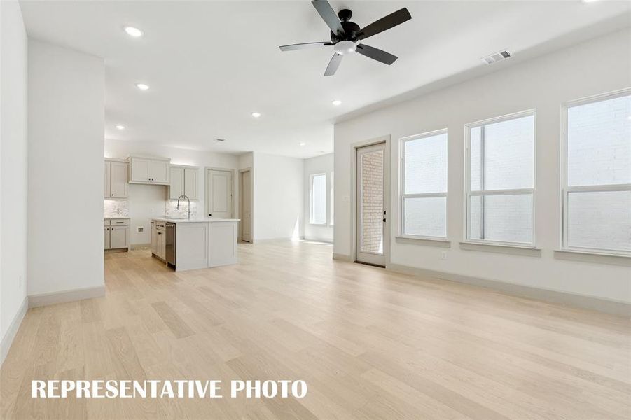 This light and bright open concept floor plan begs for the entertaining to begin!  REPRESENTATIVE PHOTO