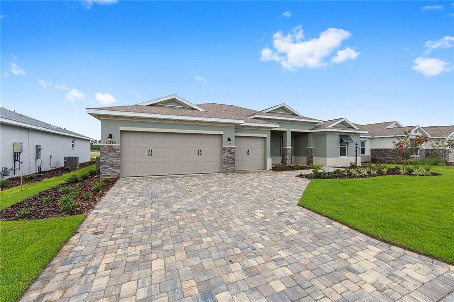 Front exterior of a new home in On Top of the World Communities, Ocala, FL, highlighting curb appeal (Image 20).
