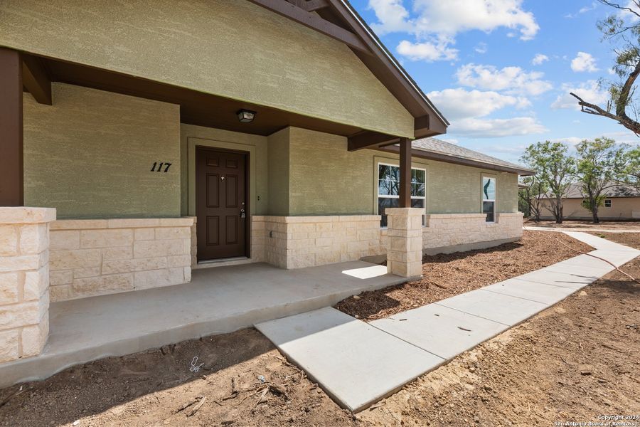 Front exterior of a new home in , Pleasanton, TX, highlighting curb appeal (Image 28). Front exterior of a new home in , Pleasanton, TX, highlighting curb appeal (Image 28).