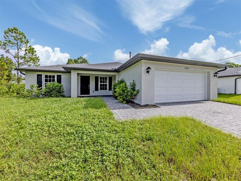 Front exterior of a new home in , Port Charlotte, FL, highlighting curb appeal (Image 2).