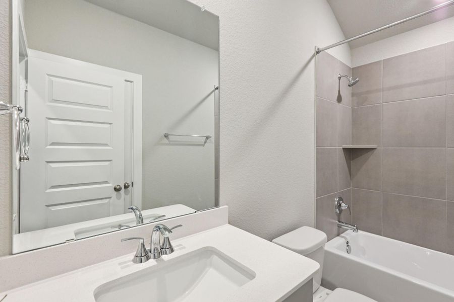 Furnished interior view inside a new home in Massey Oaks - Premier Series, Pearland (Image 5). Furnished interior view inside a new home in Massey Oaks - Premier Series, Pearland (Image 5).