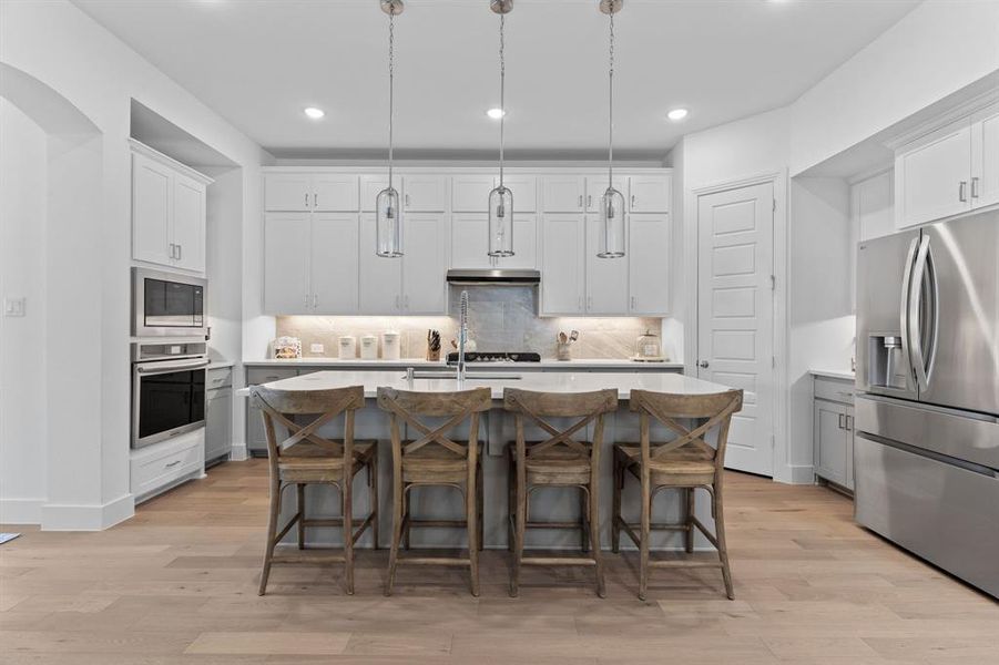 Cherished features of this awesome kitchen include the upper cabinets for seasonal storage, undercabinet lighting, a big island for everyday dining & pendant lights. Cherished features of this awesome kitchen include the upper cabinets for seasonal storage, undercabinet lighting, a big island for everyday dining & pendant lights.