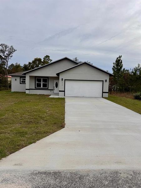 Front exterior of a new home in , Dunnellon, FL, highlighting curb appeal (Image 21).