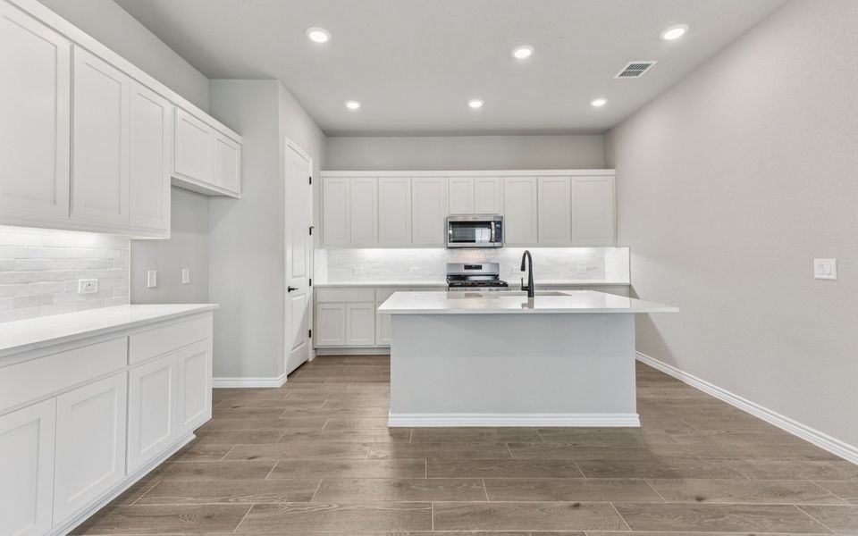 Furnished interior view inside a new home in Kissing Tree, San Marcos (Image 5).