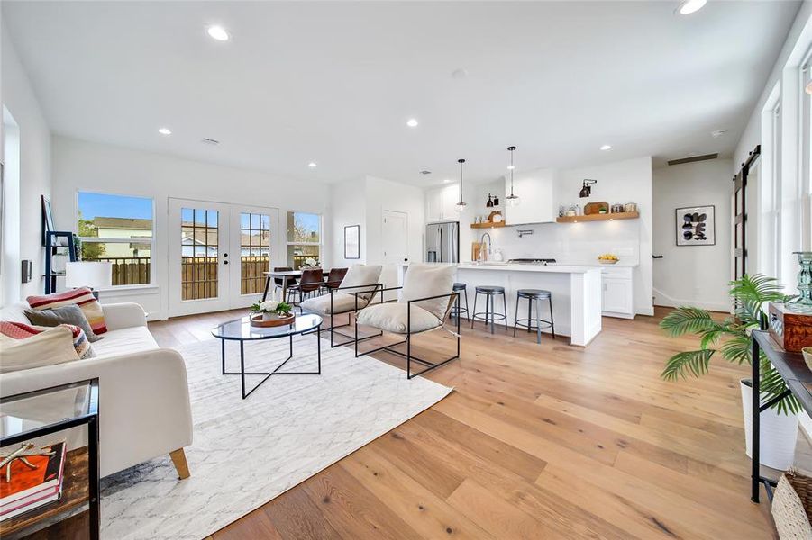 This photo was taken in another staged property with the same finishes and layout. View of 1st floor living from the front door.