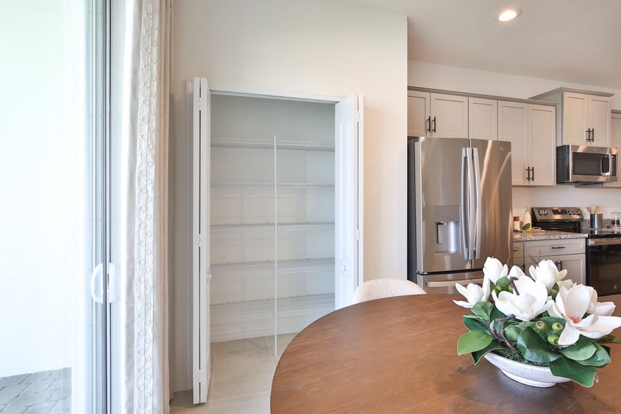 Representative furnished interior of a home built from the Morgan by Neal Communities in SkySail, Naples (Image 17).