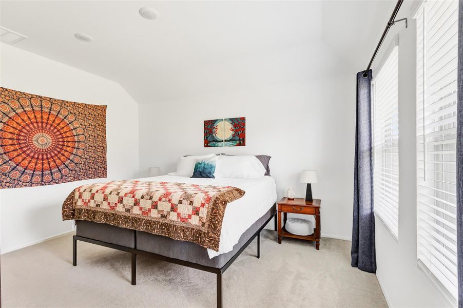 Primary bedroom located in rear of home for privacy.