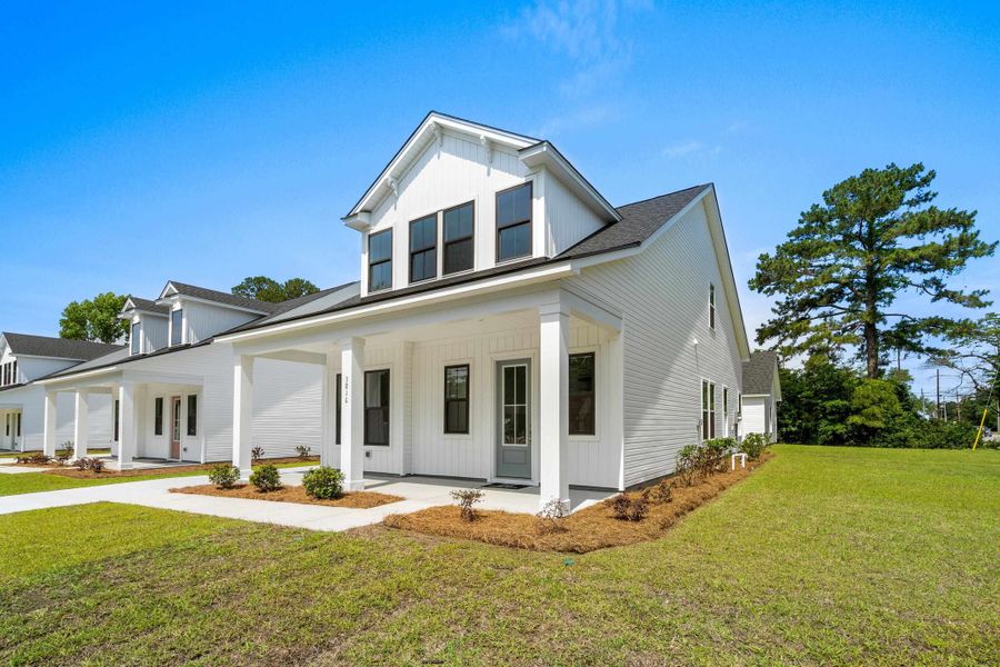 Front exterior of a new home in Downtown Loris Homes, Loris, SC, highlighting curb appeal (Image 26).