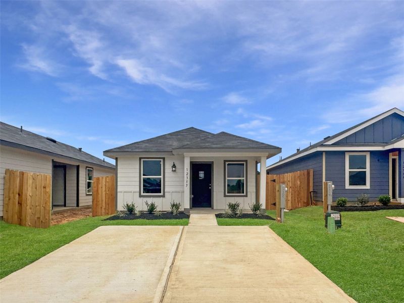 Front exterior of a new home in Castles Edge, Willis, TX, highlighting curb appeal (Image 1). Front exterior of a new home in Castles Edge, Willis, TX, highlighting curb appeal (Image 1).