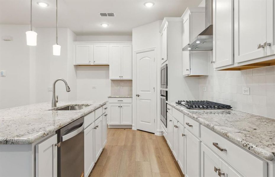 Kitchen featuring a large island ideal for informal dining and gatherings *Real home pictured