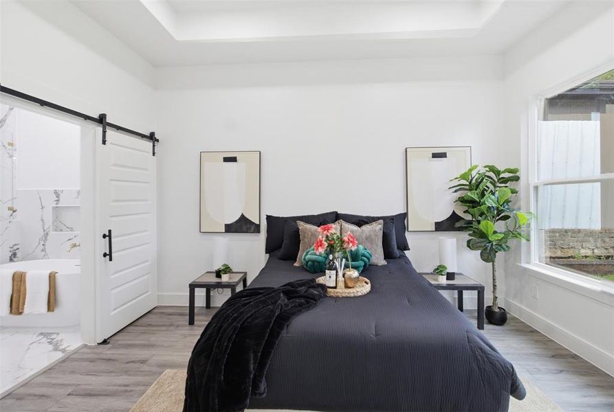 Light gray wood-finish flooring with a white tray ceiling