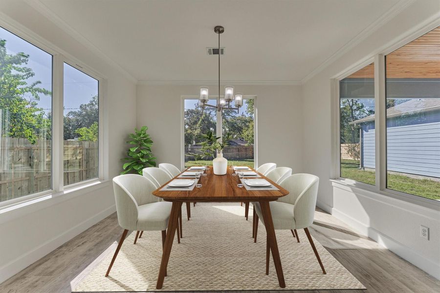 Incredible! The dining room is wrapped in sunlight with expansive windows in every direction. Imagine sipping your morning coffee with this view. Incredible! The dining room is wrapped in sunlight with expansive windows in every direction. Imagine sipping your morning coffee with this view.