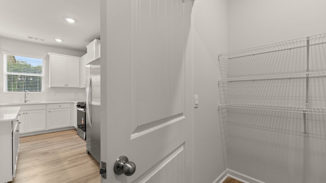 Representative unfurnished interior of a home built from the Mansfield by D.R. Horton in Liberty Crossing, Braselton (Image 23).