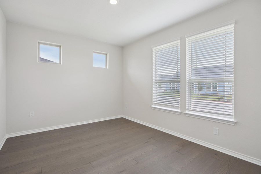 Unfurnished room featuring dark wood finished floors and recessed lighting