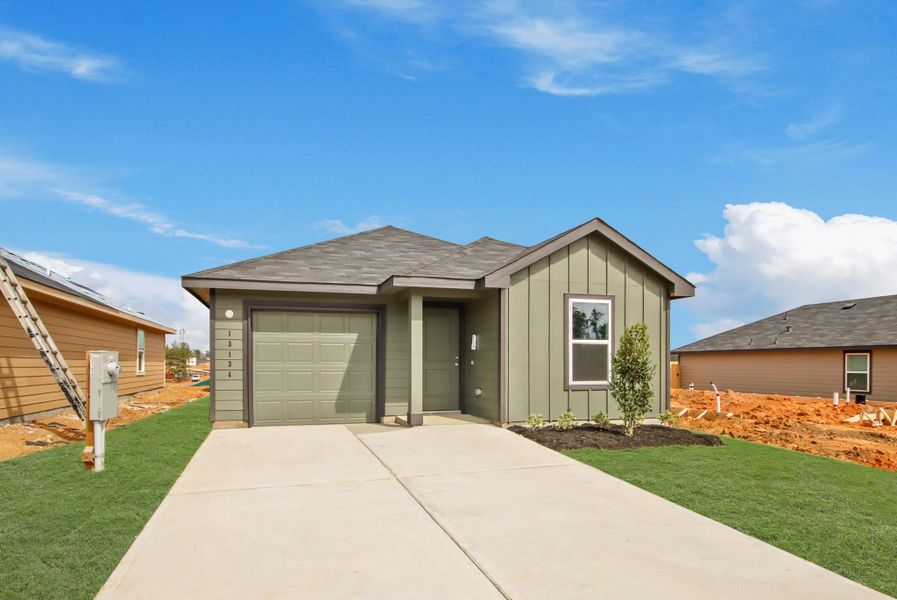 Front exterior of a new home in McCrorey Trails, Conroe, TX, highlighting curb appeal (Image 15).