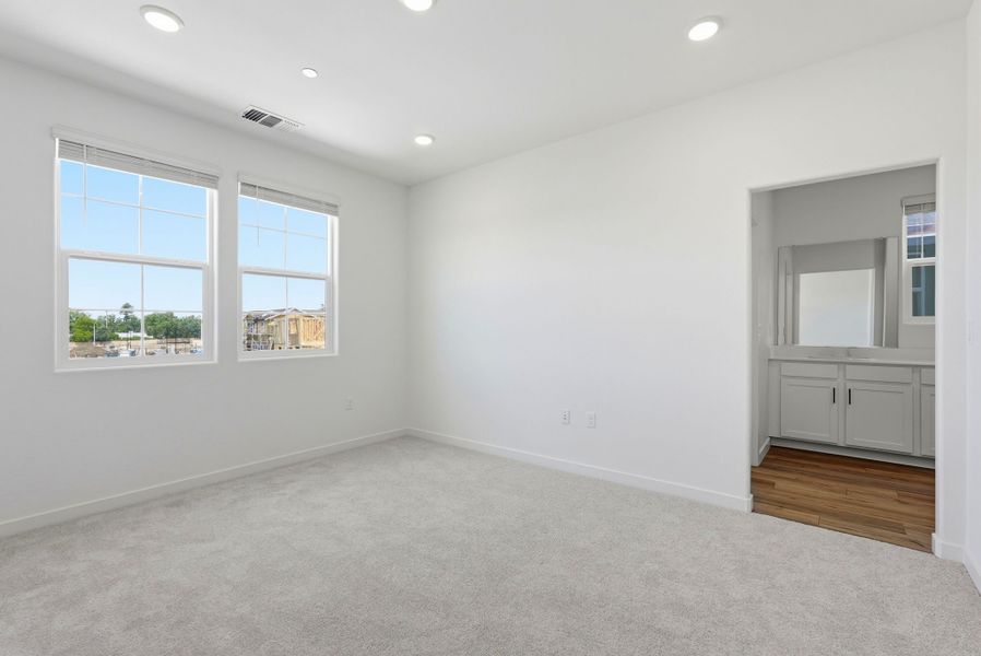A room with white walls and windows. A room with white walls and windows.