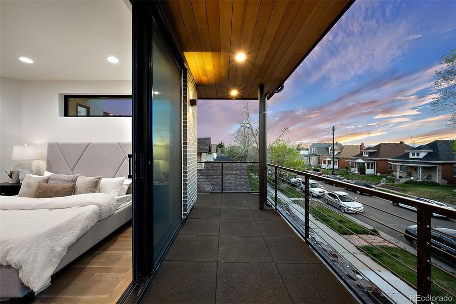 Private, covered porch off of primary bedroom for morning coffee or evening sunsets