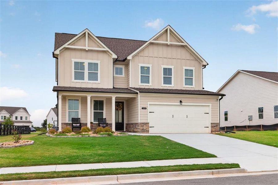 Front exterior of a new home in , Hoschton, GA, highlighting curb appeal (Image 26). Front exterior of a new home in , Hoschton, GA, highlighting curb appeal (Image 26).