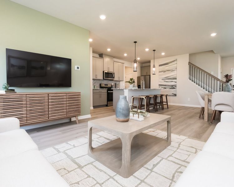 Spacious main floor perfect for hosting or relaxing at home. Spacious main floor perfect for hosting or relaxing at home.