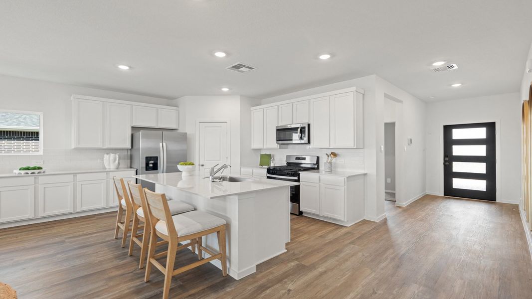 Representative furnished interior of a home built from the Rosemont by D.R. Horton in Sunterra Lakes, Brookshire (Image 9).