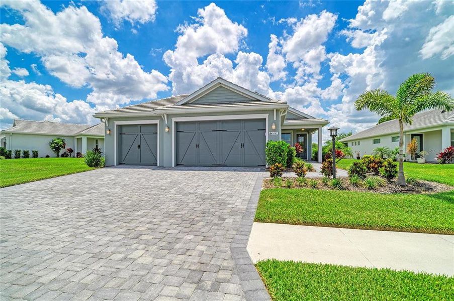 Front exterior of a new home in , Sarasota, FL, highlighting curb appeal (Image 23).