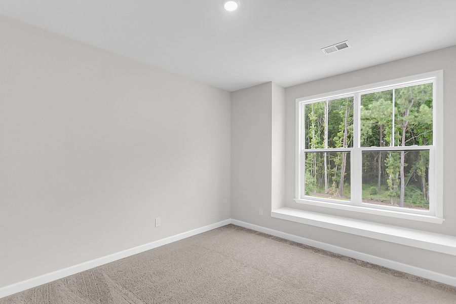 Spacious, unfurnished interior of a new home in Pineland Preserve, Summerville (Image 32).